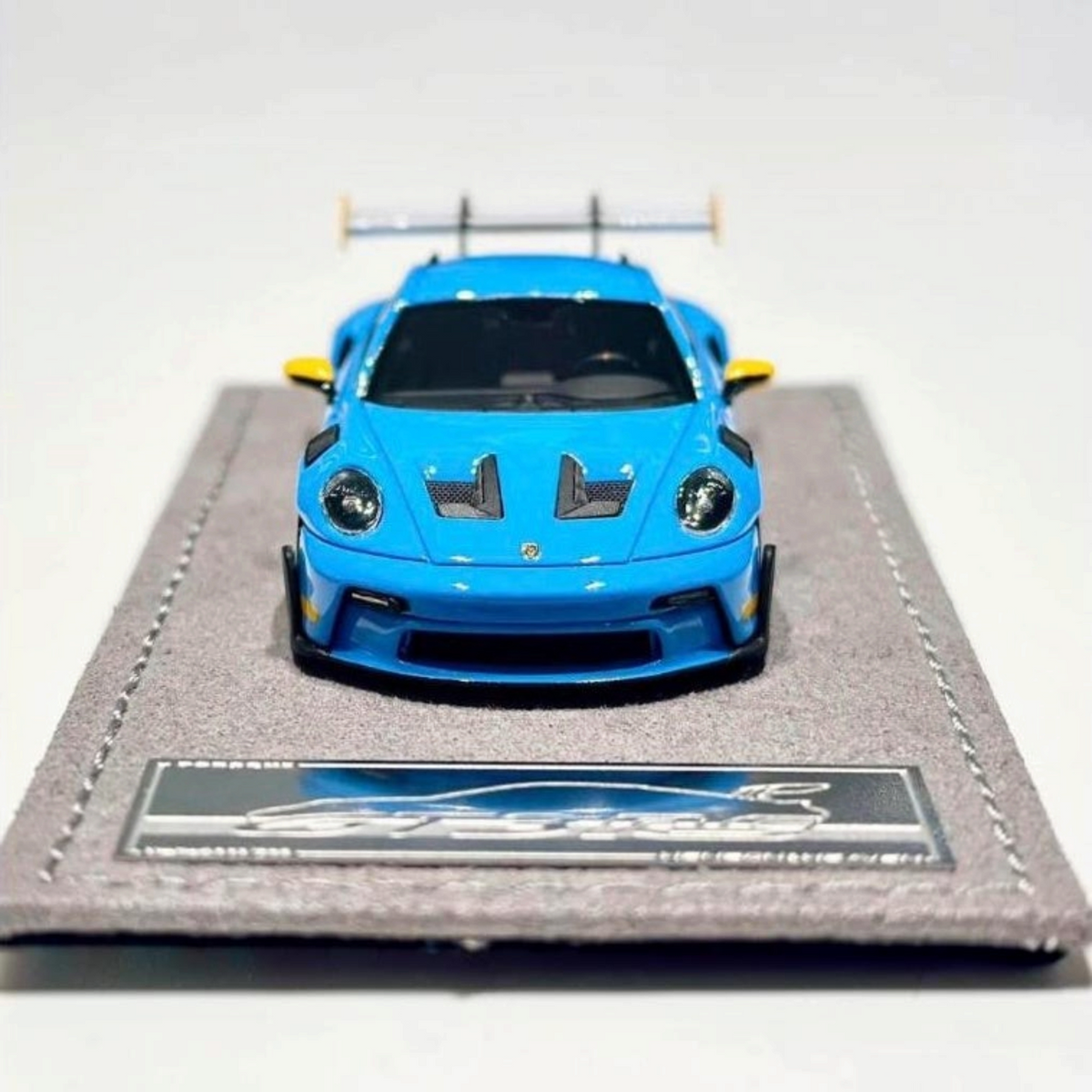 Lot57Supplies Diecast Shop 1:64 scale resin Porsche 992.1 GT3 RS model car in Riviera Blue on a display base