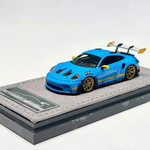 Lot57Supplies Diecast Shop 1:64 scale HH Model Porsche 992.1 GT3 RS in Riviera Blue with gold wheels and rear wing.