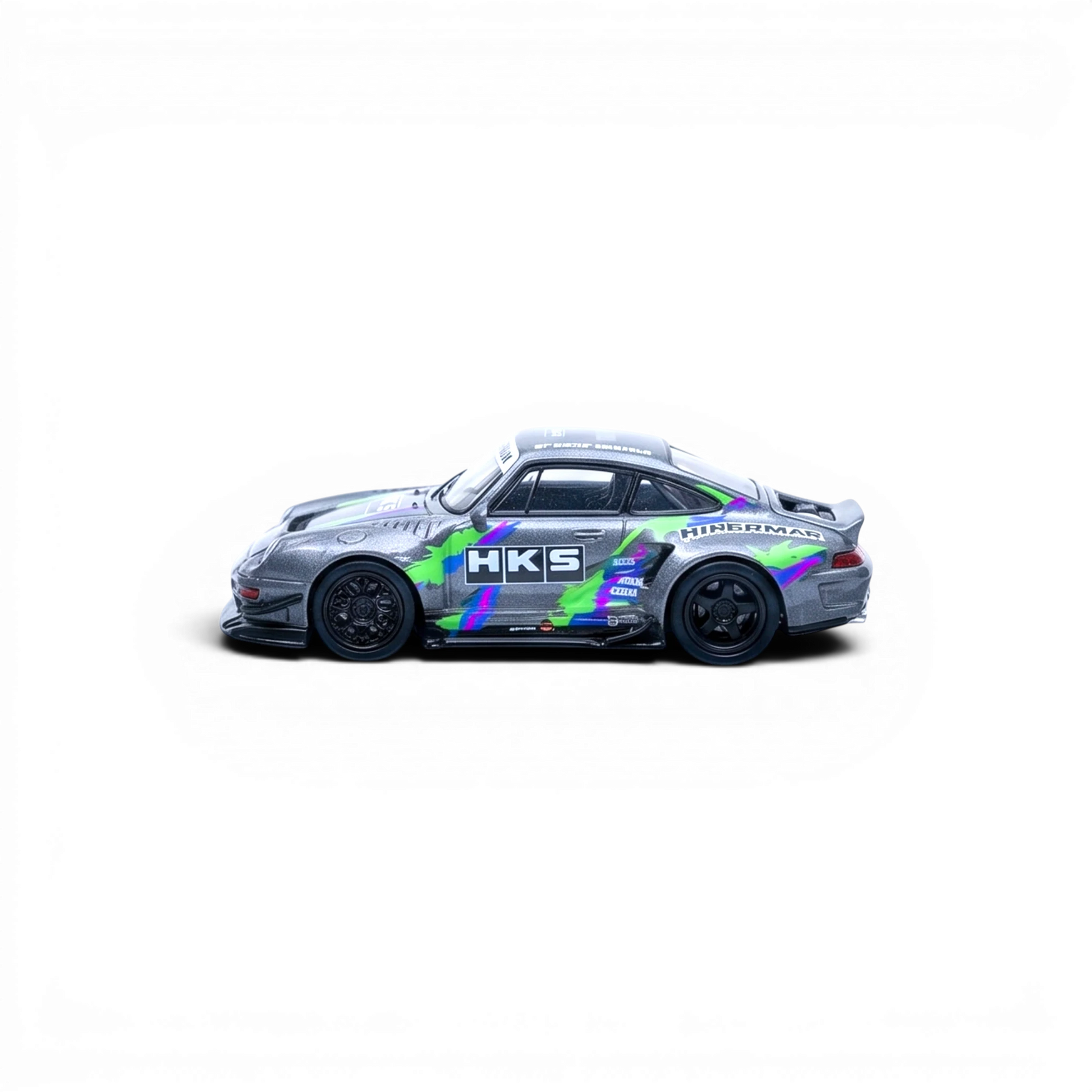 Lot57Supplies Diecast Shop 1:64 scale silver Porsche 993 modified diecast model with HKS livery and green/purple accents.