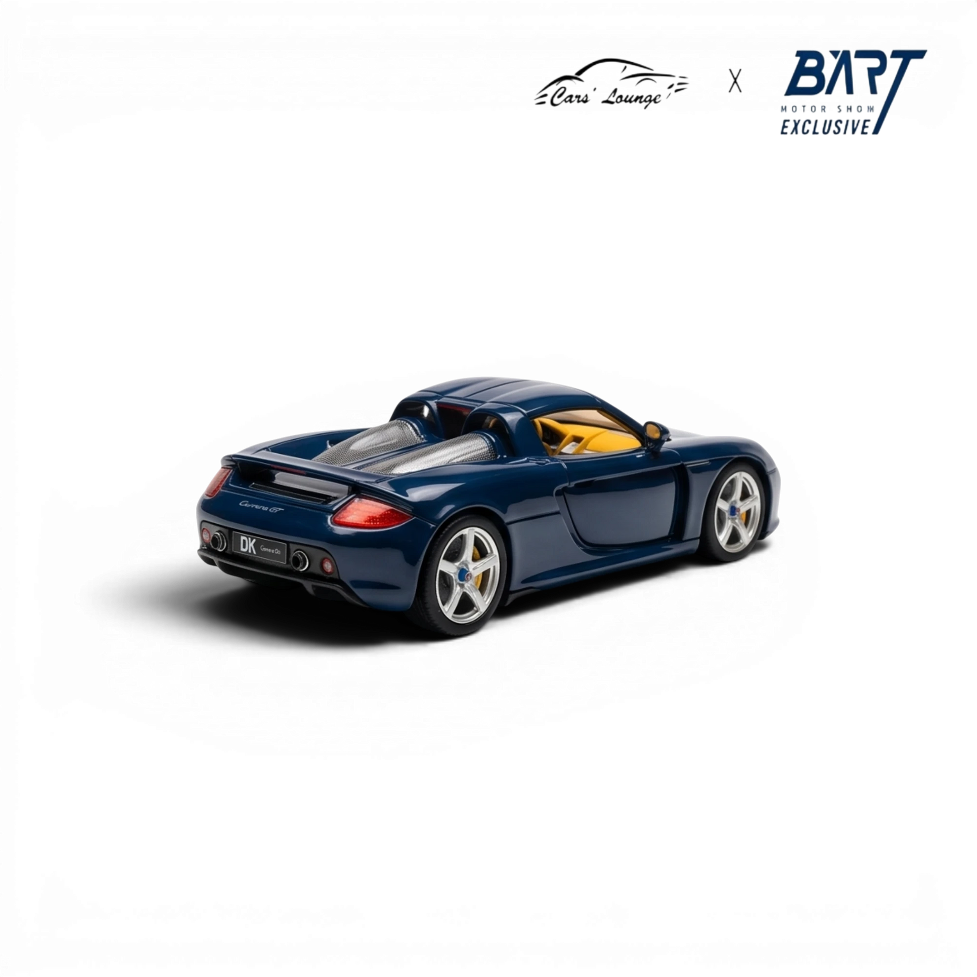 Lot57Supplies Diecast Shop blue 1:64 scale resin Porsche Carrera GT model with yellow interior.