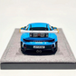Lot57Supplies Diecast Shop 1:64 scale HH Model Porsche 992.1 GT3 RS in Riviera Blue, rear view on display base.
