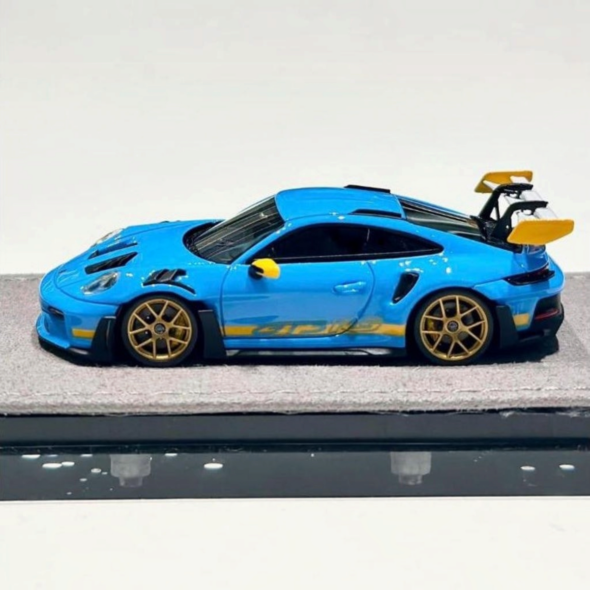 Lot57Supplies Diecast Shop 1:64 scale HH Model Porsche 992.1 GT3 RS in Riviera Blue with gold wheels and rear wing