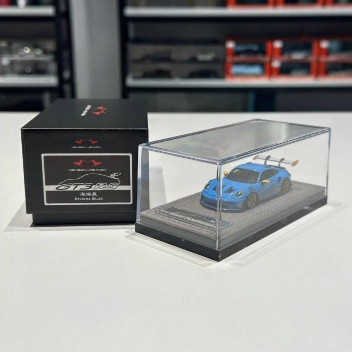 Lot57Supplies Diecast Shop HH Model 1:64 scale resin Porsche 992.1 GT3 RS in Riviera Blue with display case and box