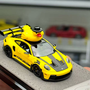 Lot57Supplies Diecast Shop HH Model 1:64 scale Porsche 992.1 GT3 RS in speed yellow with a rubber duck on the roof