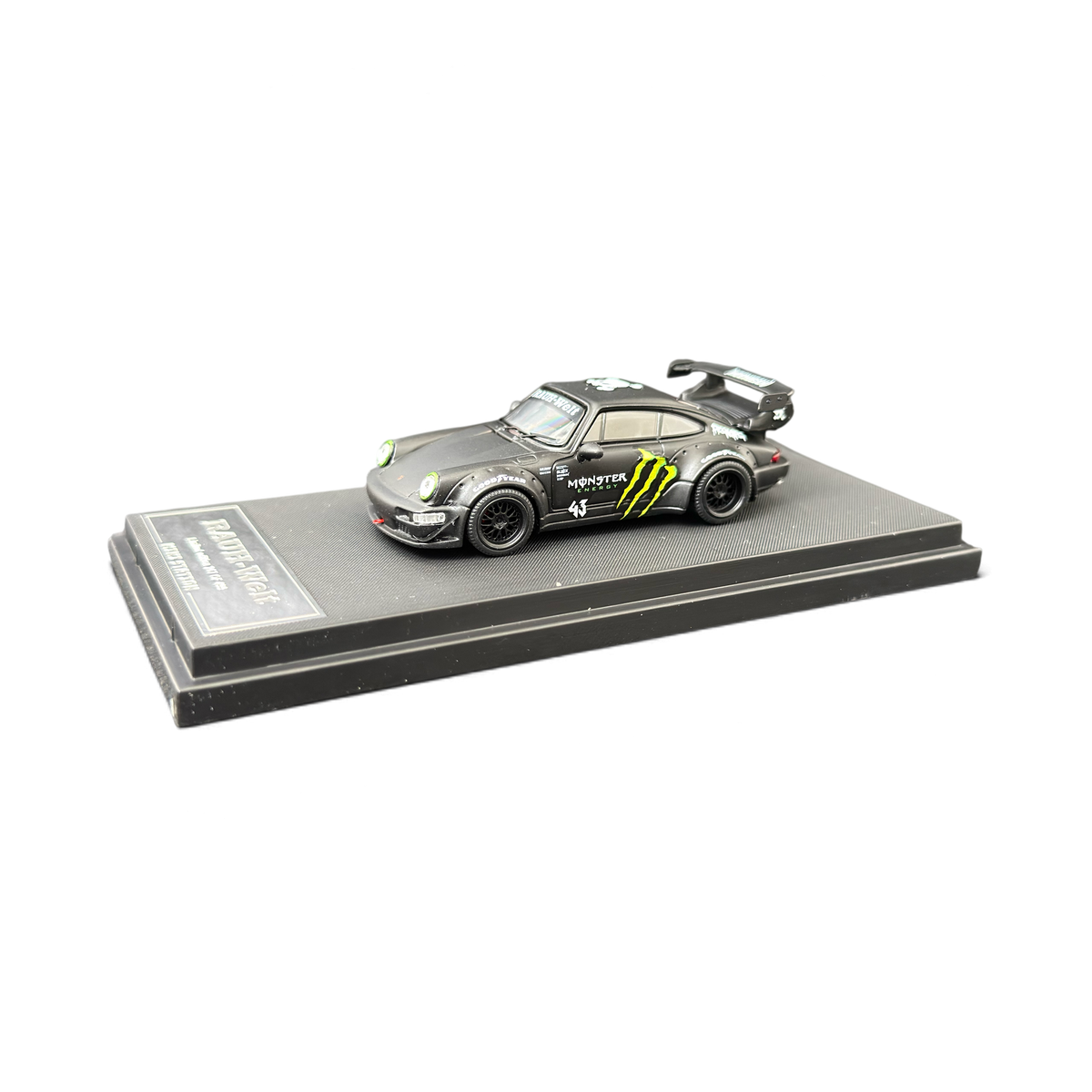 Lot57Supplies Diecast Shop Mini Station 1:64 scale diecast Porsche RWB 964 model car with black Monster Energy livery