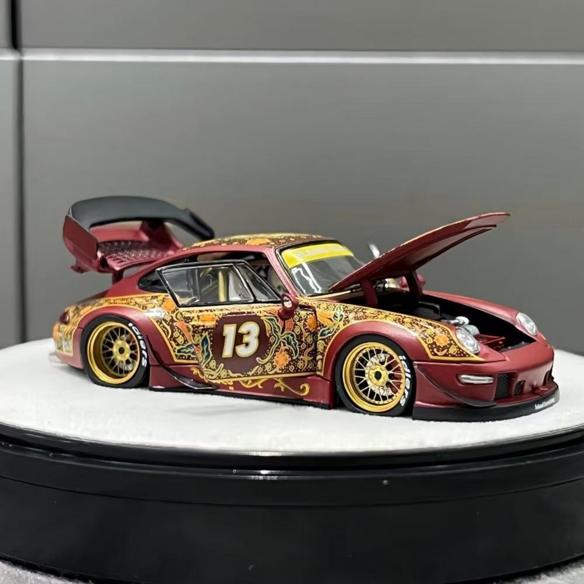 Lot57Supplies Diecast Shop PGM Porsche RWB 993 Batik 13 diecast model in red with gold alloy wheels and open hood