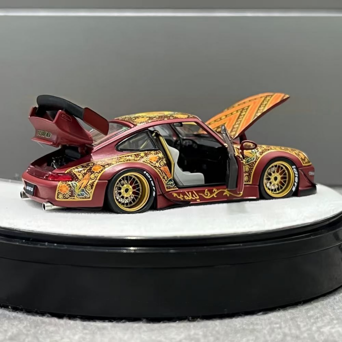 Lot57Supplies Diecast Shop PGM Porsche RWB 993 Batik 13 diecast model in red with gold alloy wheels and open doors