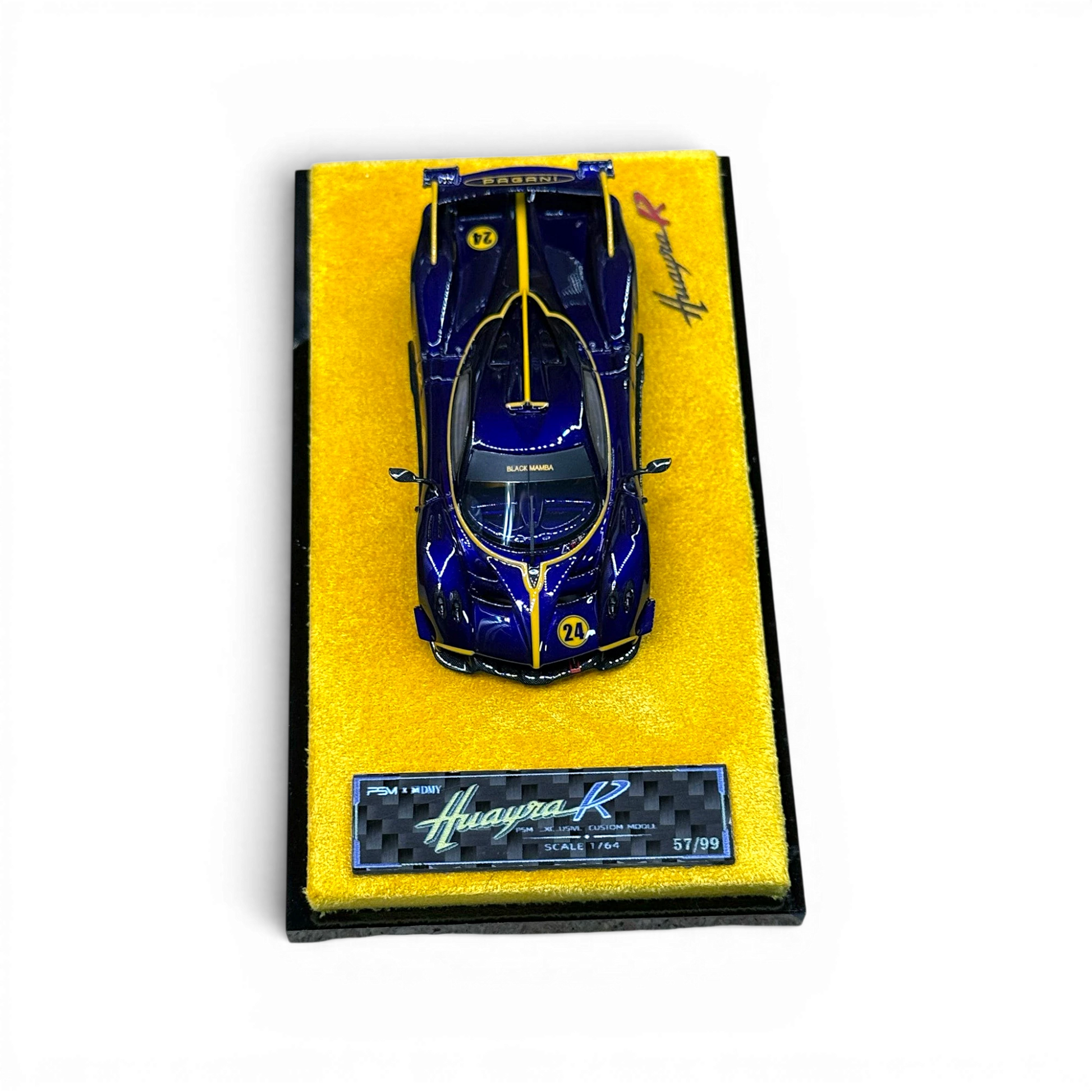 Lot57Supplies Diecast Shop 1:64 scale purple carbon fiber Pagani Huayra R resin model car on a yellow display base
