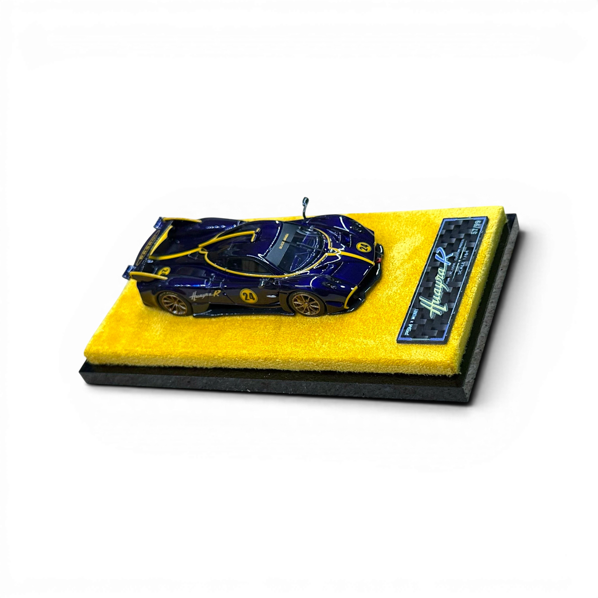 Lot57Supplies Diecast Shop 1:64 scale purple carbon fiber Pagani Huayra R resin model car on a yellow display base