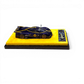 Lot57Supplies Diecast Shop 1:64 scale purple carbon fiber Pagani Huayra R model car on a yellow display base.