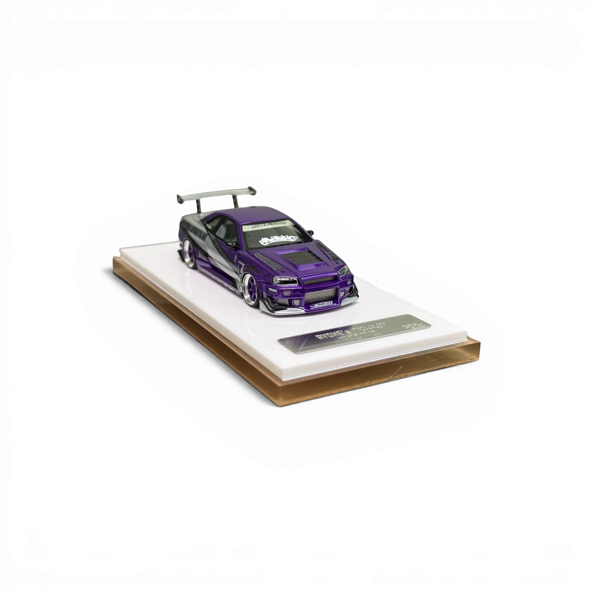 Lot57Supplies Diecast Shop 1:64 scale purple Nissan Skyline R34 GIFTED resin model car on a white display base.