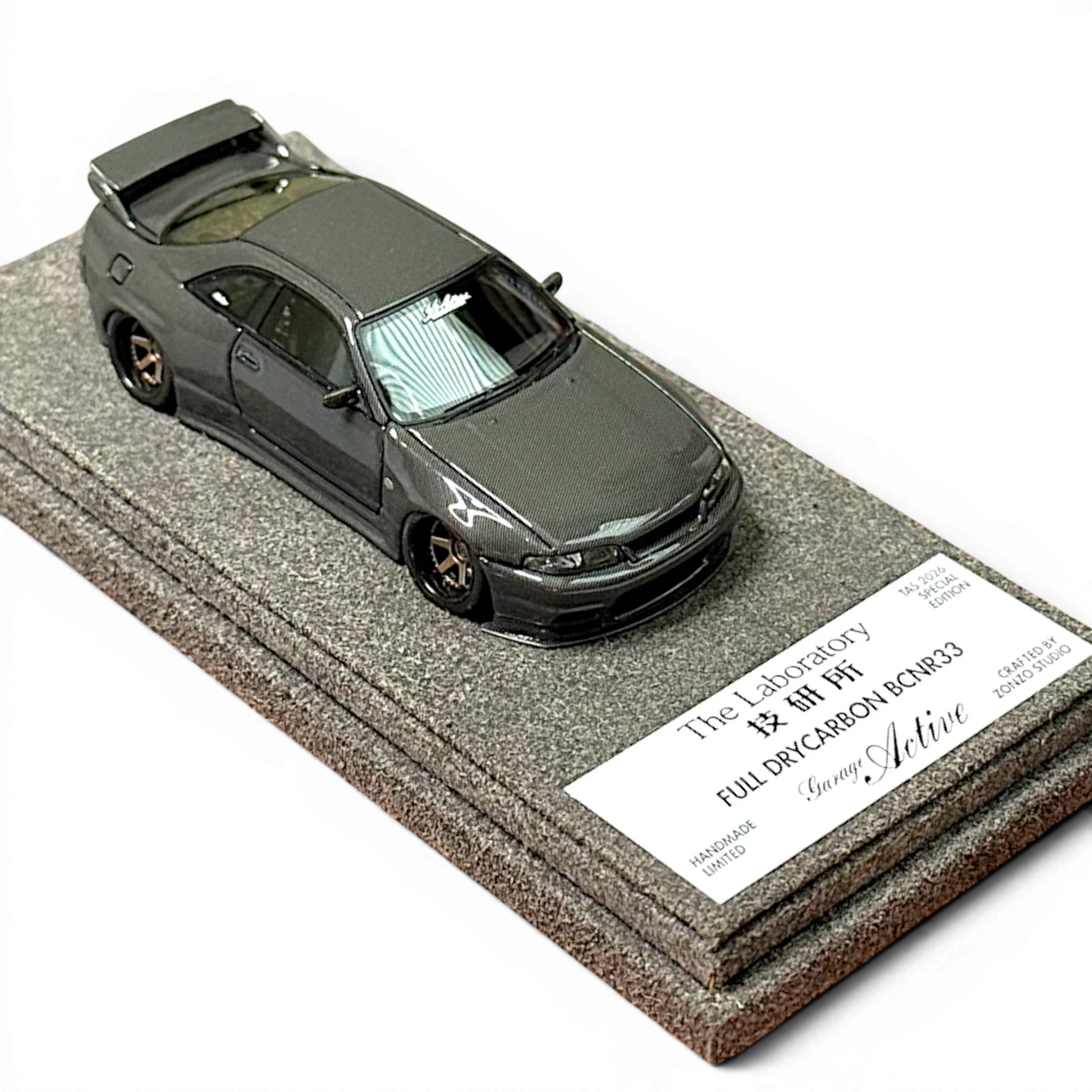 Lot57Supplies Diecast Shop 1:64 scale The Laboratory x Zonzo Garage Active R33 widebody model in full visible carbon.