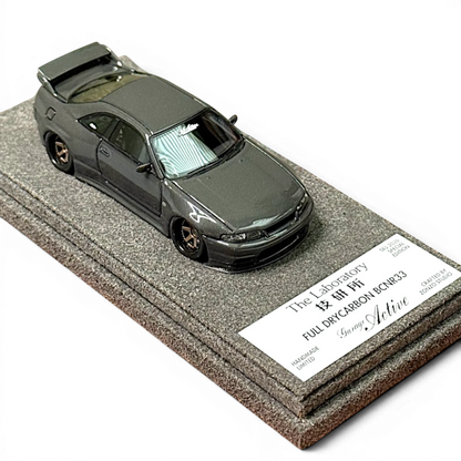 Lot57Supplies Diecast Shop 1:64 scale The Laboratory x Zonzo Garage Active R33 widebody model in full visible carbon.