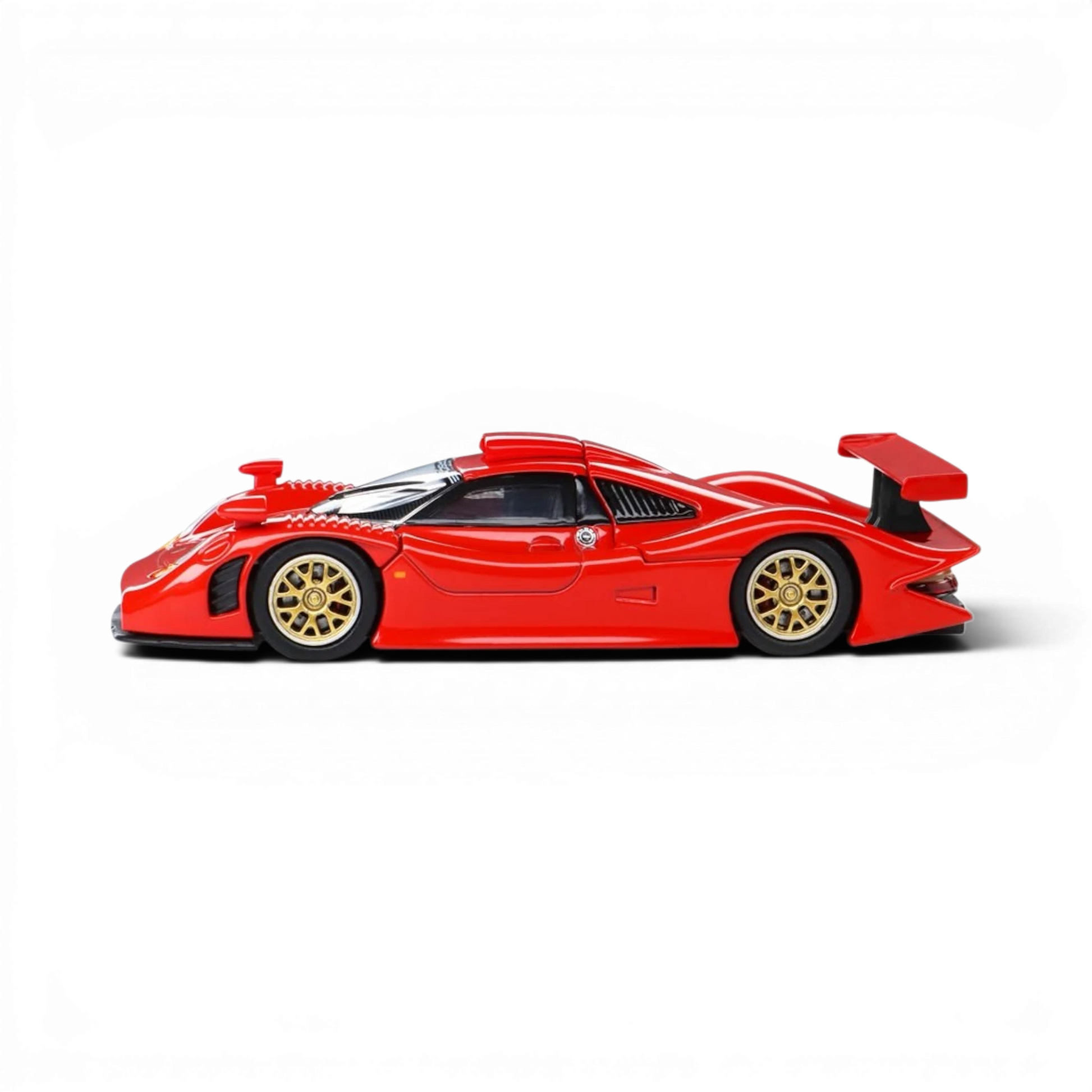 Lot57Supplies Diecast Shop 1:64 scale red Porsche 911 GT1 1998 diecast model car with gold wheels, side profile view.