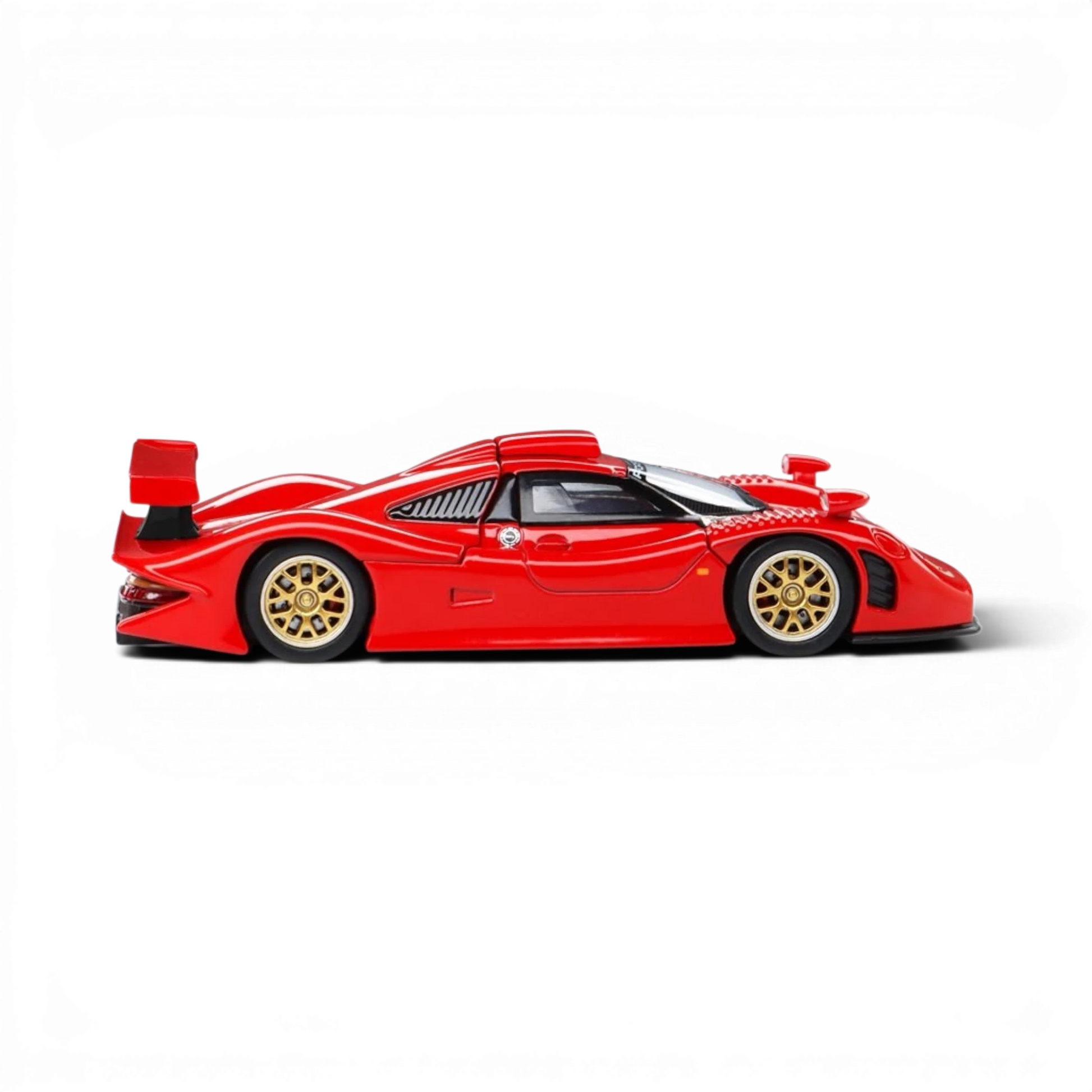Lot57Supplies Diecast Shop red Trends Hobby Porsche 911 GT1 1998 diecast model car in 1:64 scale, side view.