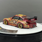 Lot57Supplies Diecast Shop PGM Porsche RWB 993 Batik 13 diecast car in red with gold alloys and intricate patterns