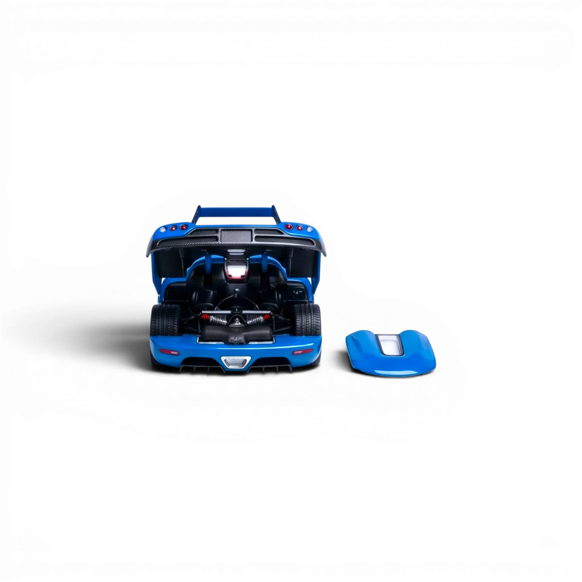 Lot57Supplies Diecast Shop blue 1:64 scale Rhino Model Koenigsegg CC850 diecast car with open hood and detached front panel.