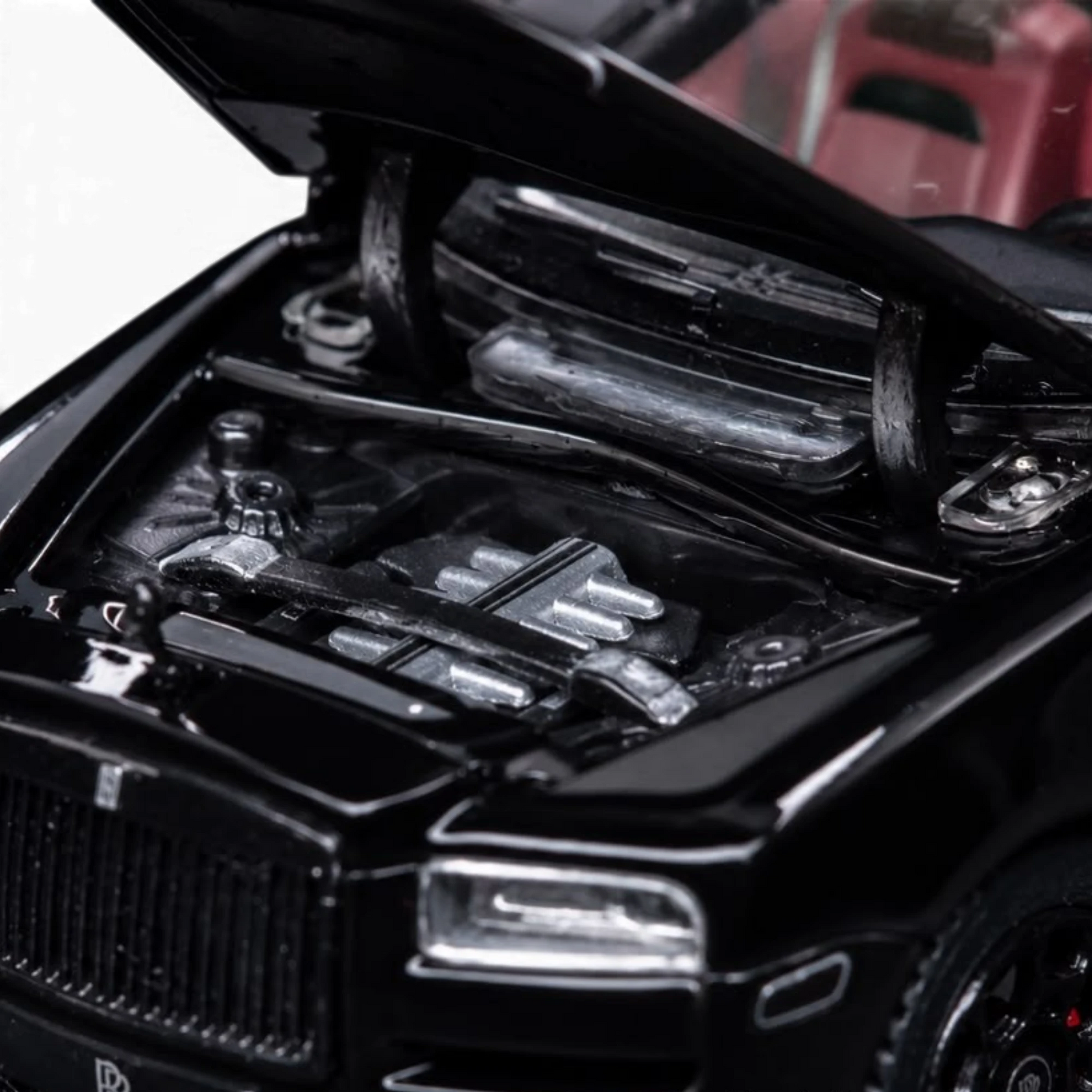 Lot57Supplies Diecast Shop 1:64 scale DCM Rolls-Royce Cullinan Black Warrior diecast model with open hood engine detail