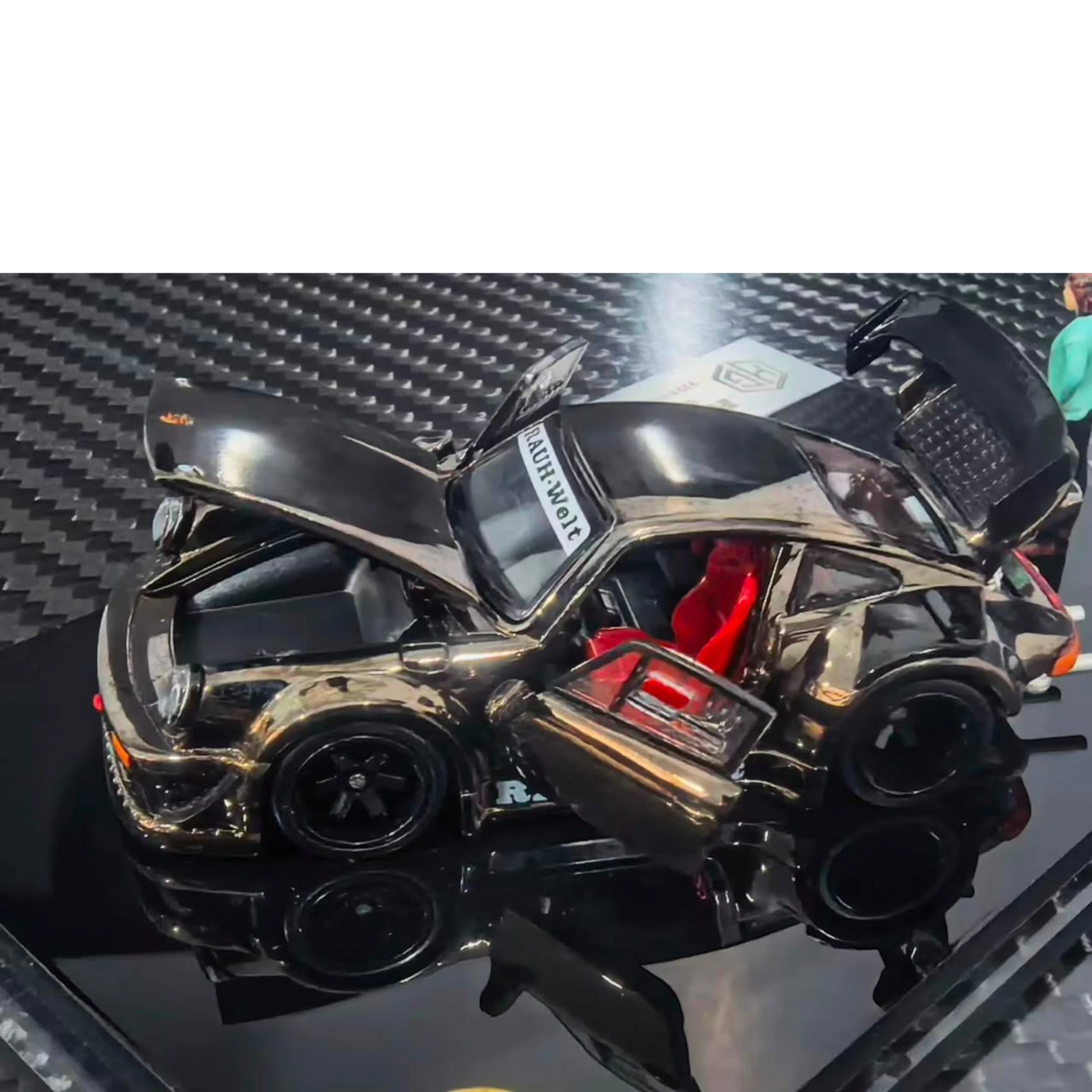Lot57Supplies Diecast Shop FG Customized RWB930 diecast car in chrome gunmetal with open doors and hood, includes figure.