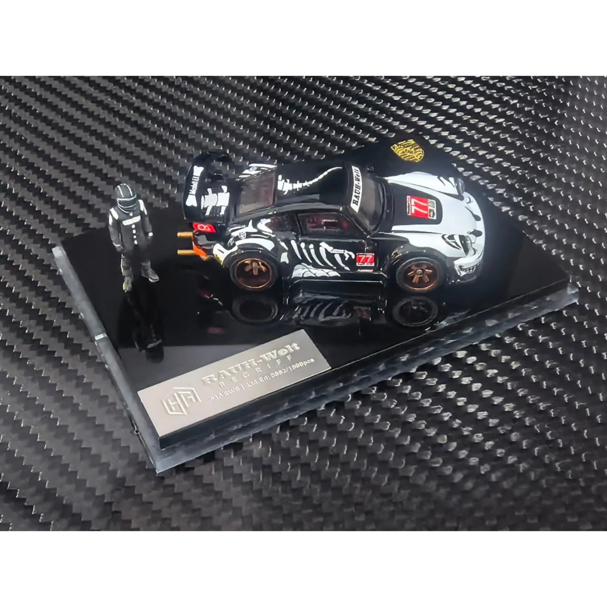Lot57Supplies Diecast Shop 1:64 scale RWB930 diecast model car in black and white with skeleton graphics and figure