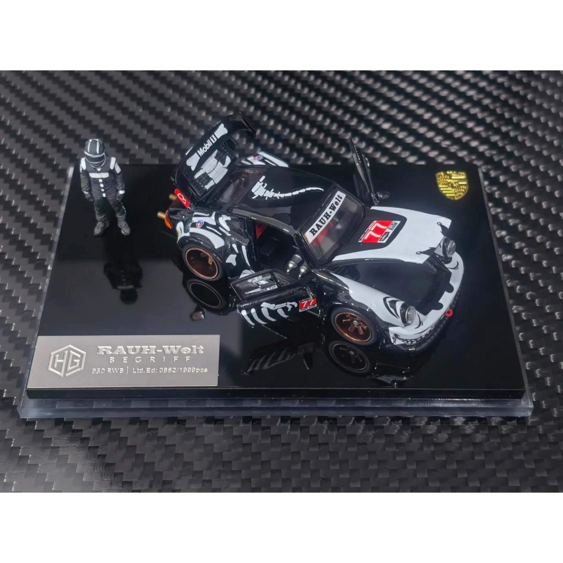 Lot57Supplies Diecast Shop 1:64 scale RWB 930 diecast model car in black and white with open doors and driver figure