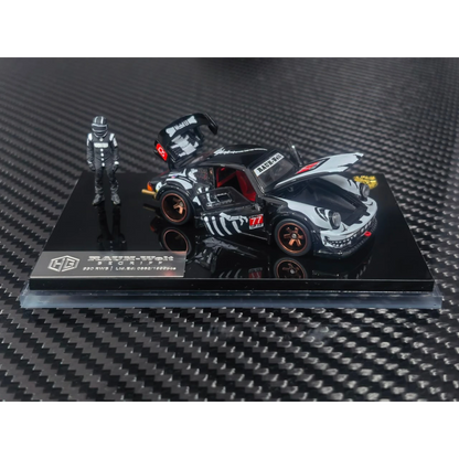 Lot57Supplies Diecast Shop 1:64 scale RWB 930 diecast model car in black with white graphics and a racing driver figure.