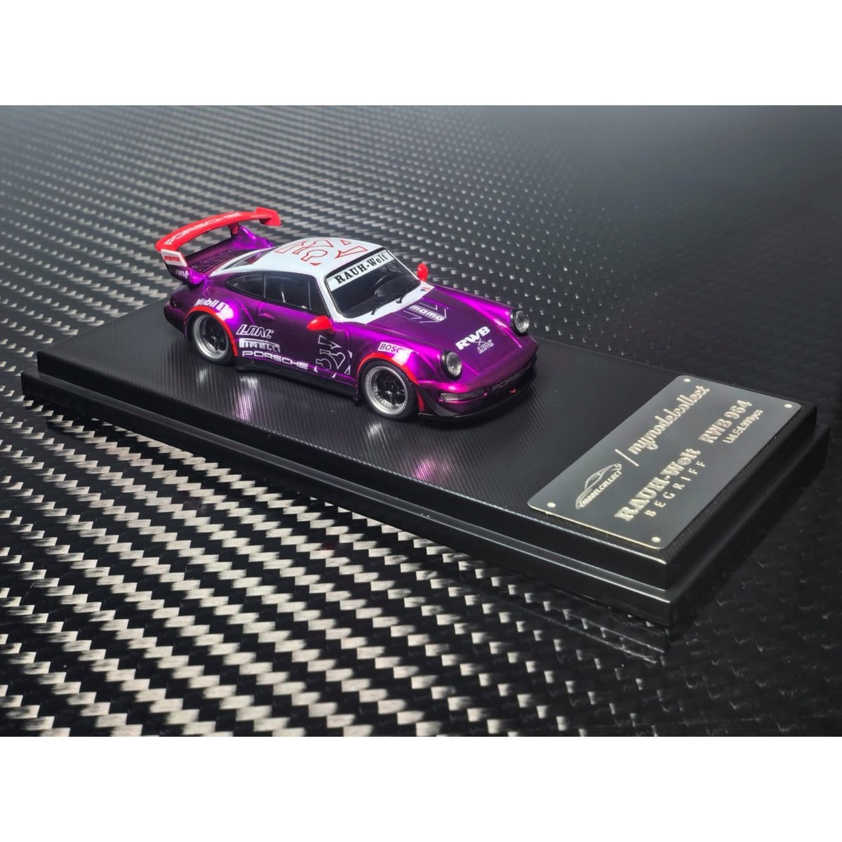 Lot57Supplies Diecast Shop MC RWB964 high wing diecast model car in transparent pink and purple on a display base