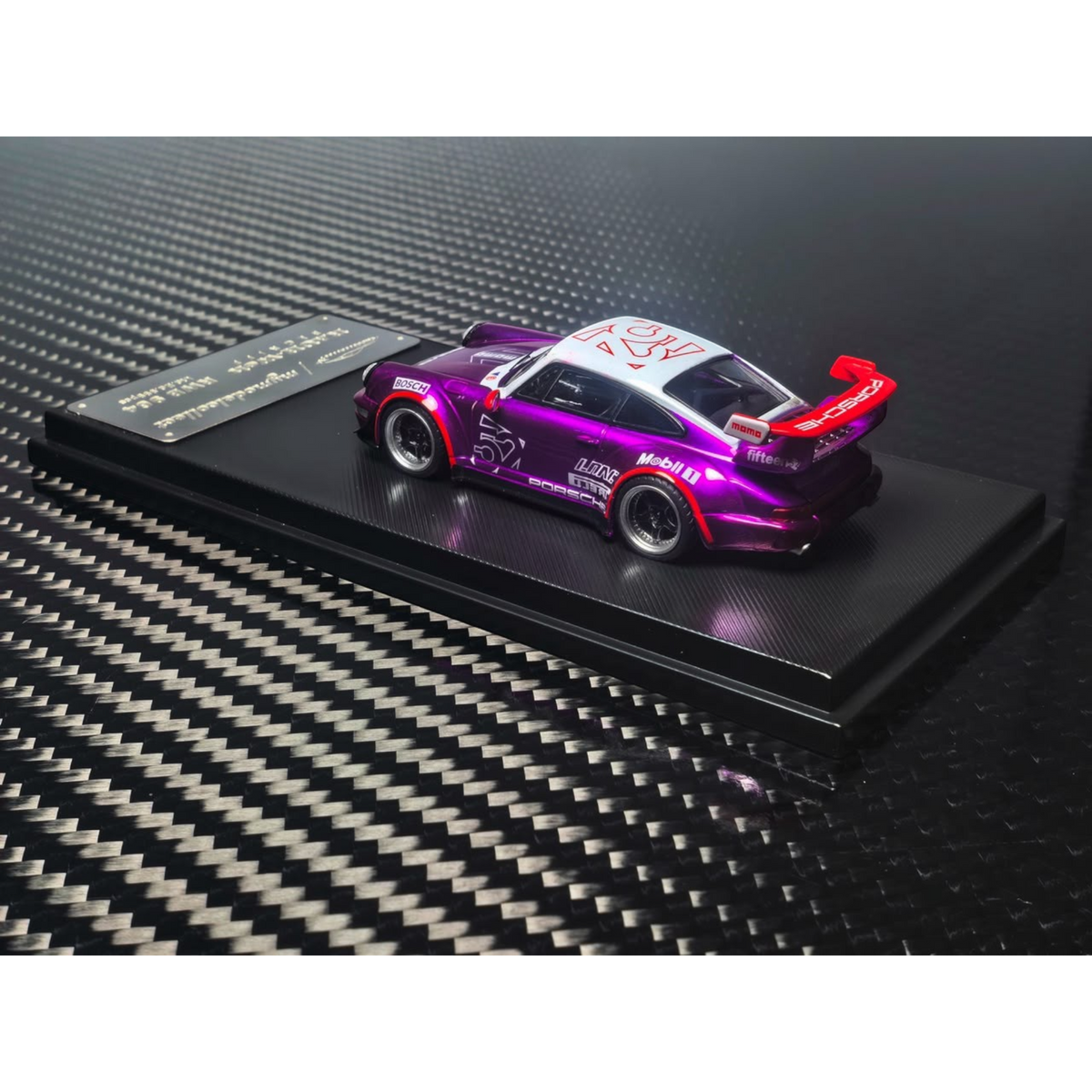 Lot57Supplies Diecast Shop 1:64 scale MC RWB964 high wing diecast car in transparent pink and purple on display base