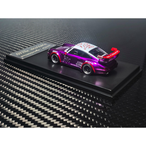 Lot57Supplies Diecast Shop 1:64 scale MC RWB964 high wing diecast car in transparent pink and purple on display base