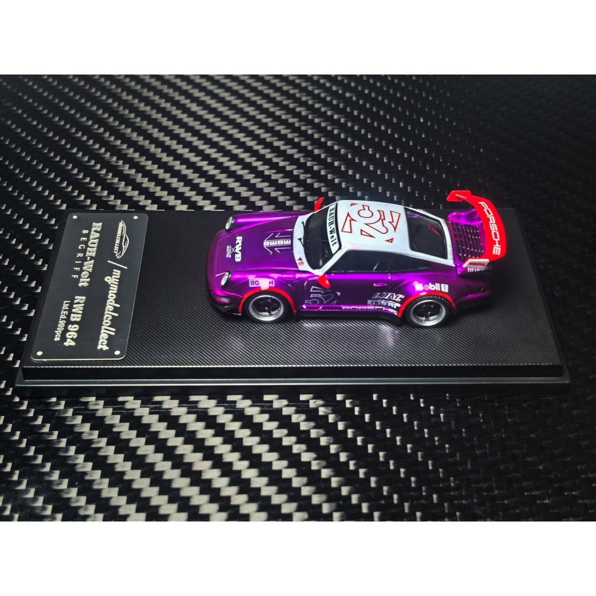 Lot57Supplies Diecast Shop MC RWB964 high wing diecast car in transparent pink and purple on a display base