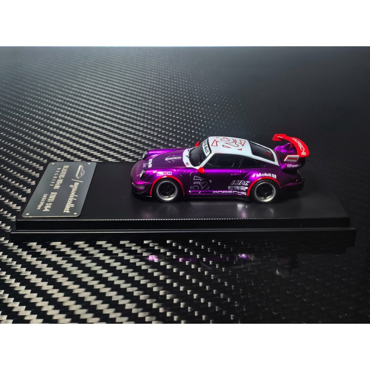 Lot57Supplies Diecast Shop MC RWB964 High Wing diecast car in transparent pink and purple on a display base