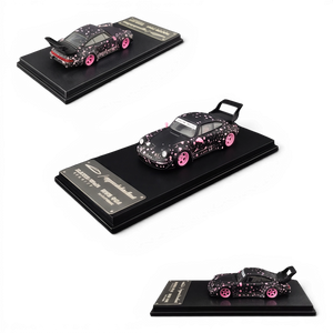 Lot57Supplies Diecast Shop MC RWB964 high wing diecast car in black with pink sakura livery on a display base