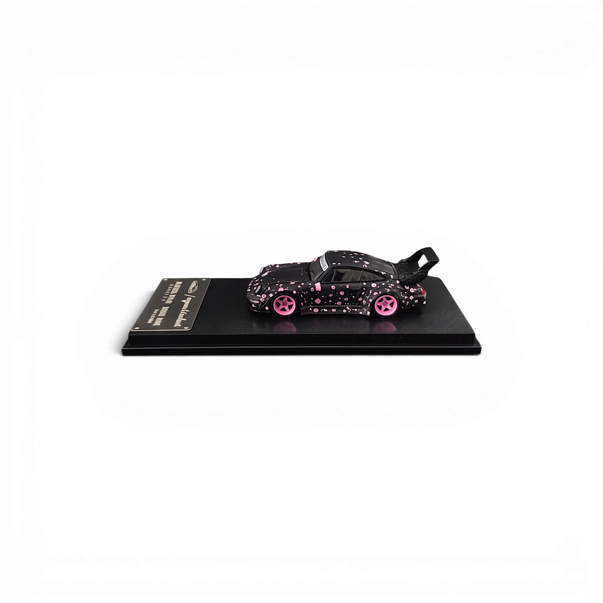 Lot57Supplies Diecast Shop MC RWB964 diecast model car in black with pink sakura livery and high wing, 1:64 scale
