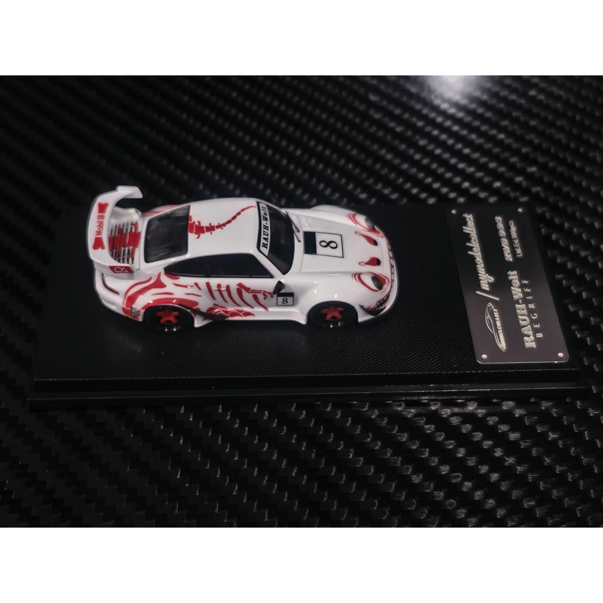 Lot57Supplies Diecast Shop MC RWB993 high wing diecast car in white with red bone dragon livery on display base