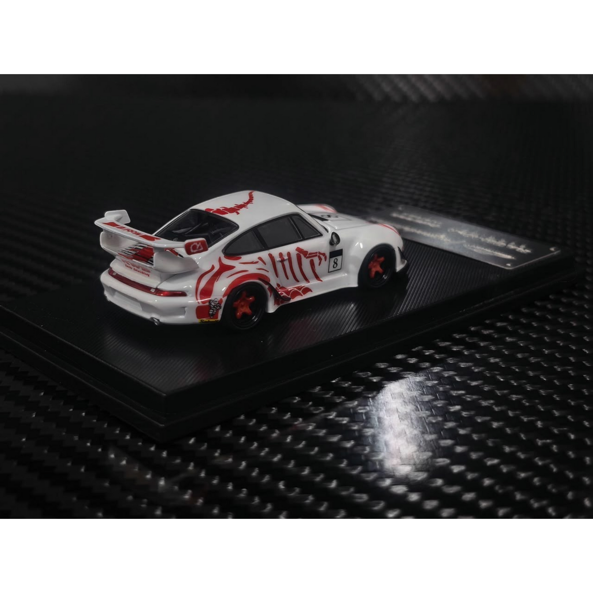 Lot57Supplies Diecast Shop 1:64 scale MC RWB993 diecast car in white with red bone dragon livery and high wing spoiler