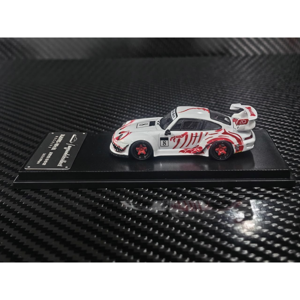 Lot57Supplies Diecast Shop 1:64 scale MC RWB993 diecast car in white with red bone dragon livery and high wing spoiler