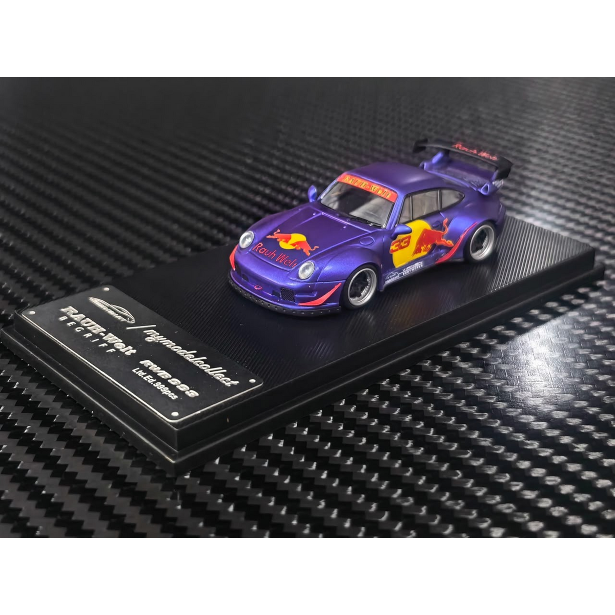 Lot57Supplies Diecast Shop 1:64 scale MC RWB993 diecast car in matte purple with Red Bull livery and high wing spoiler