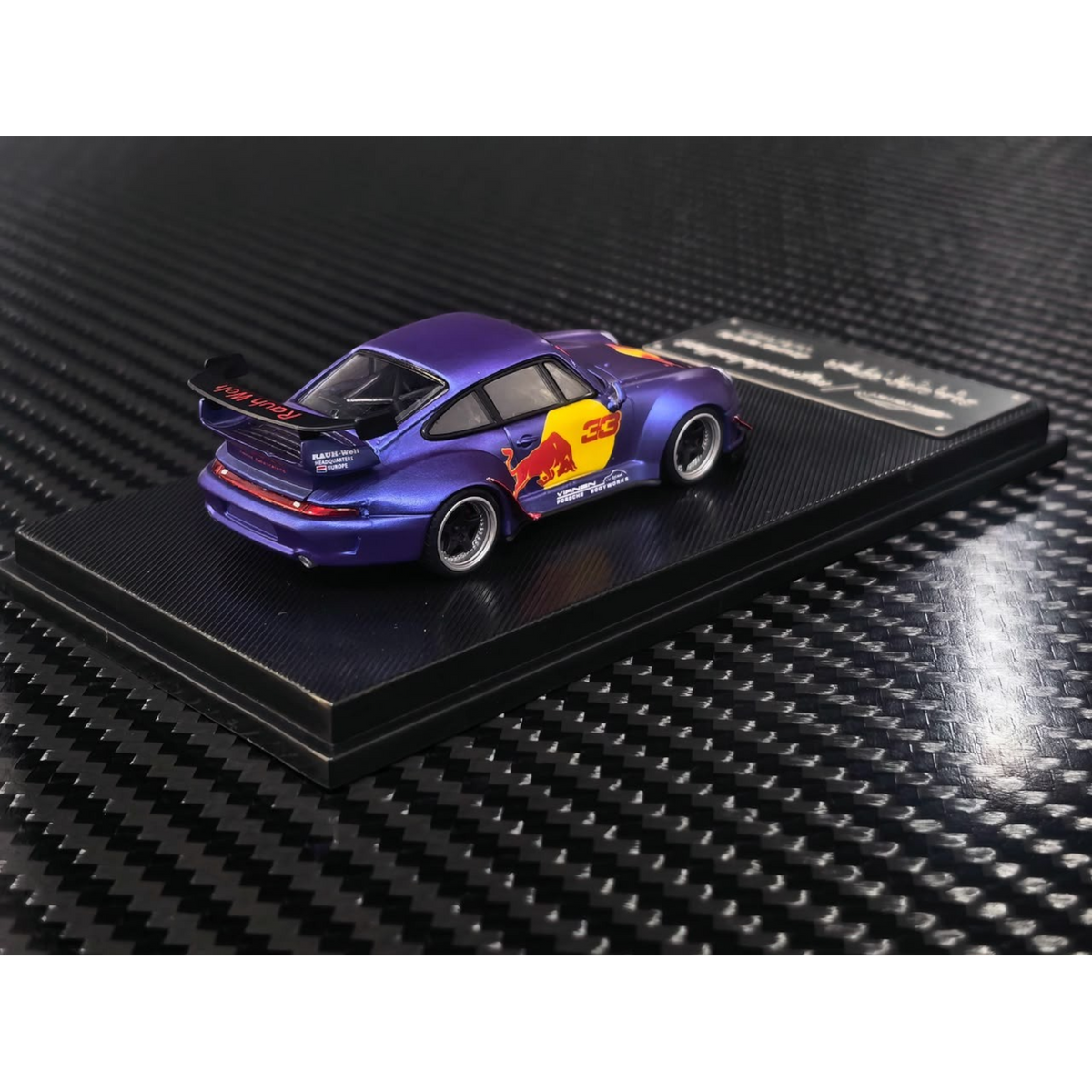 Lot57Supplies Diecast Shop MC RWB993 high wing diecast car in matte purple with Red Bull livery on a display base