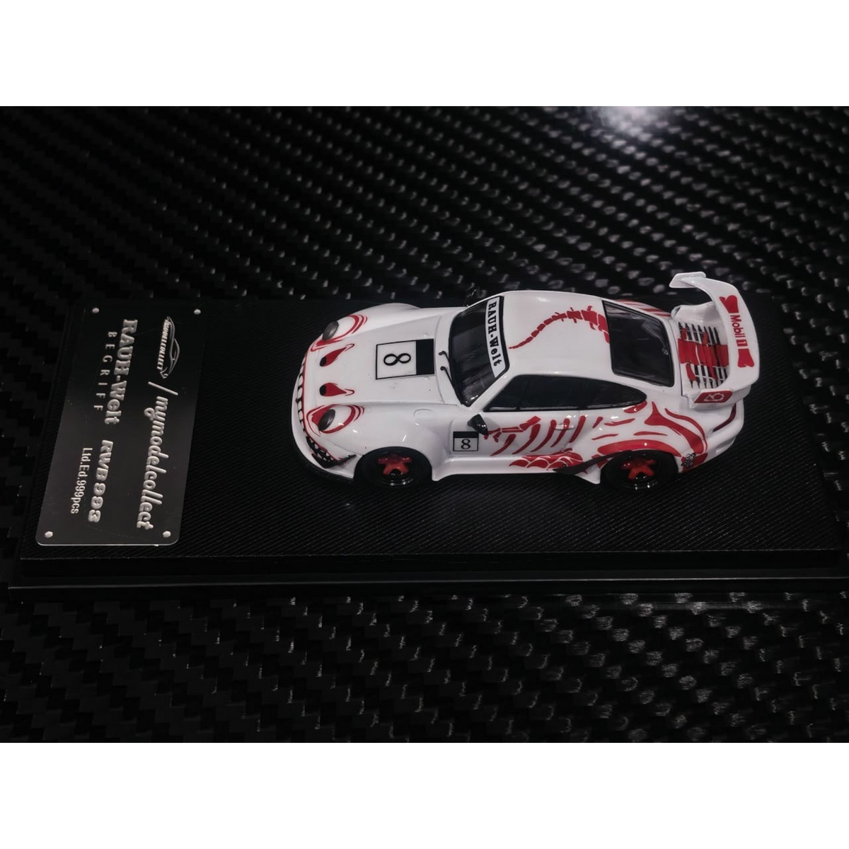 Lot57Supplies Diecast Shop MC RWB993 High Wing diecast car in white with red bone dragon livery on a display base