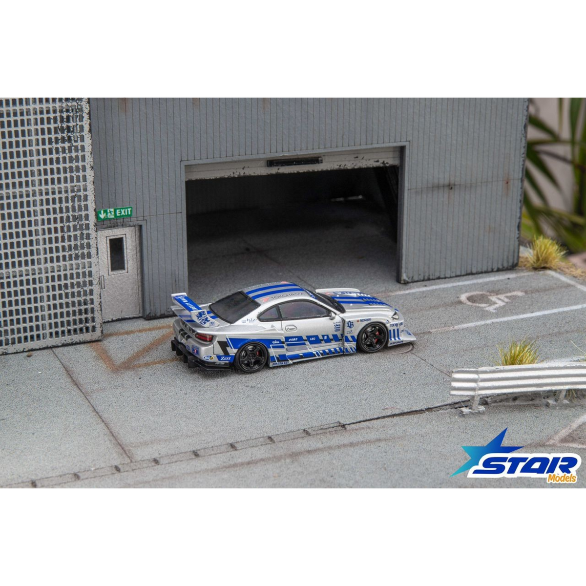 Lot57Supplies Diecast Shop 1:64 scale Star Models S15 Silvia widebody diecast car in silver and blue livery