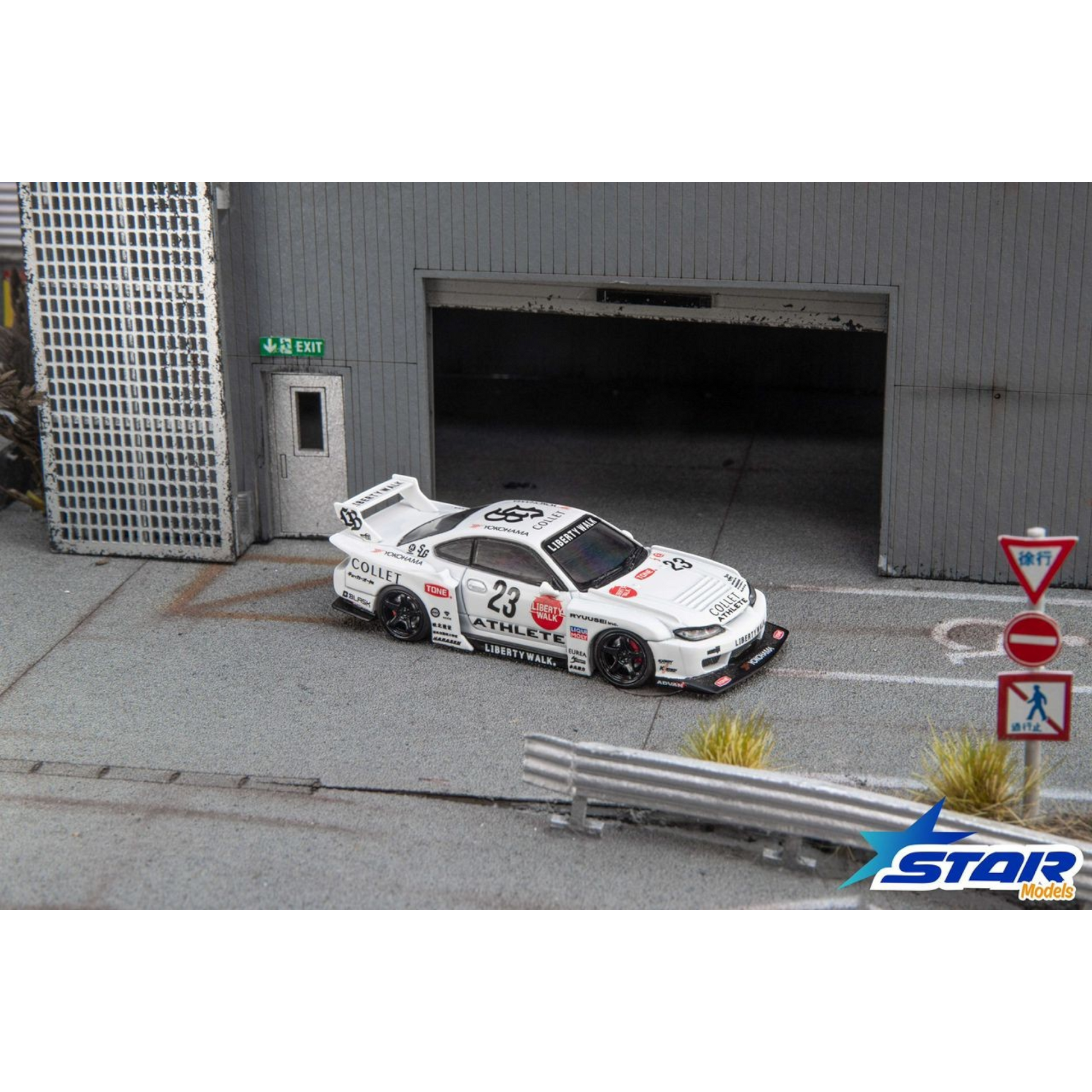 Lot57Supplies Diecast Shop Star Models 1:64 scale white S15 Silvia widebody diecast car with 23 livery in a diorama