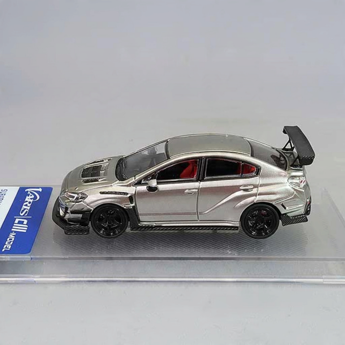 Lot57Supplies Diecast Shop CM Model 1:64 scale silver Subaru WRX Varis widebody diecast car with black wheels