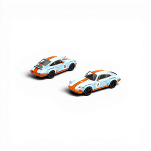 Two Lot57Supplies Diecast Shop Pop Race Singer Racing #18 diecast cars in orange and blue Gulf livery, 1:64 scale.