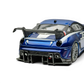 Lot57Supplies Diecast Shop metallic blue SK Model Ferrari 599XX EVO 1:64 scale diecast model with white racing stripes and large rear spoiler.