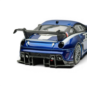 Lot57Supplies Diecast Shop metallic blue SK Model Ferrari 599XX EVO 1:64 scale diecast model with white racing stripes and large rear spoiler.