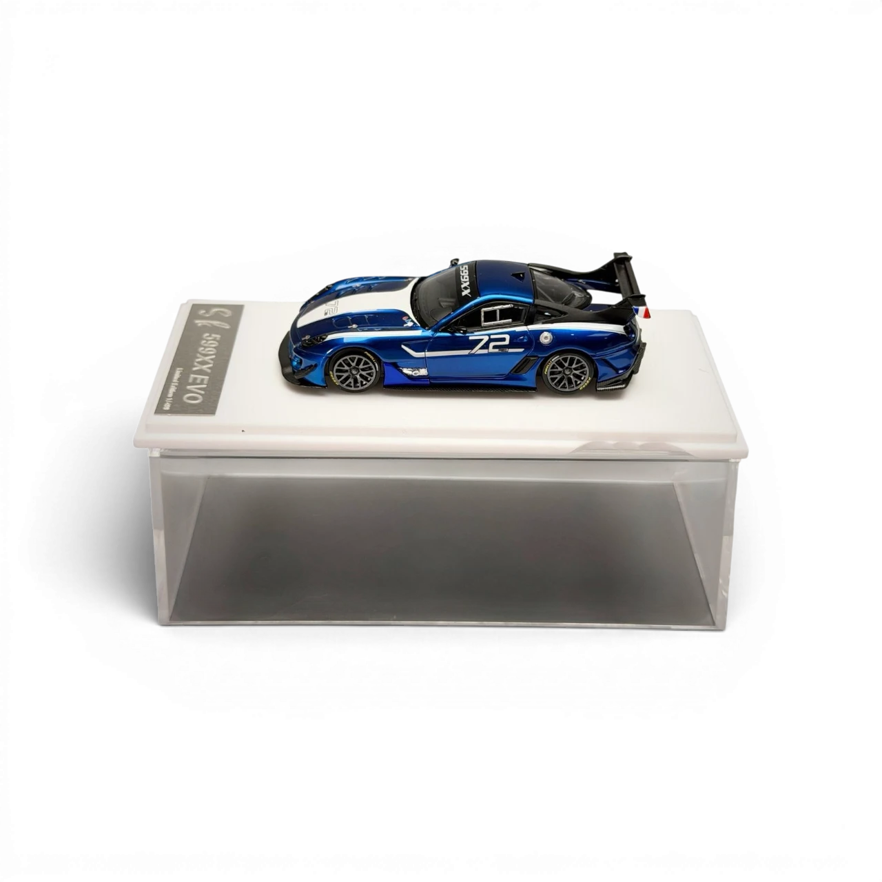 Lot57Supplies Diecast Shop metallic blue SK Model Ferrari 599XX EVO 1:64 scale diecast model car with white racing stripes and number 72.