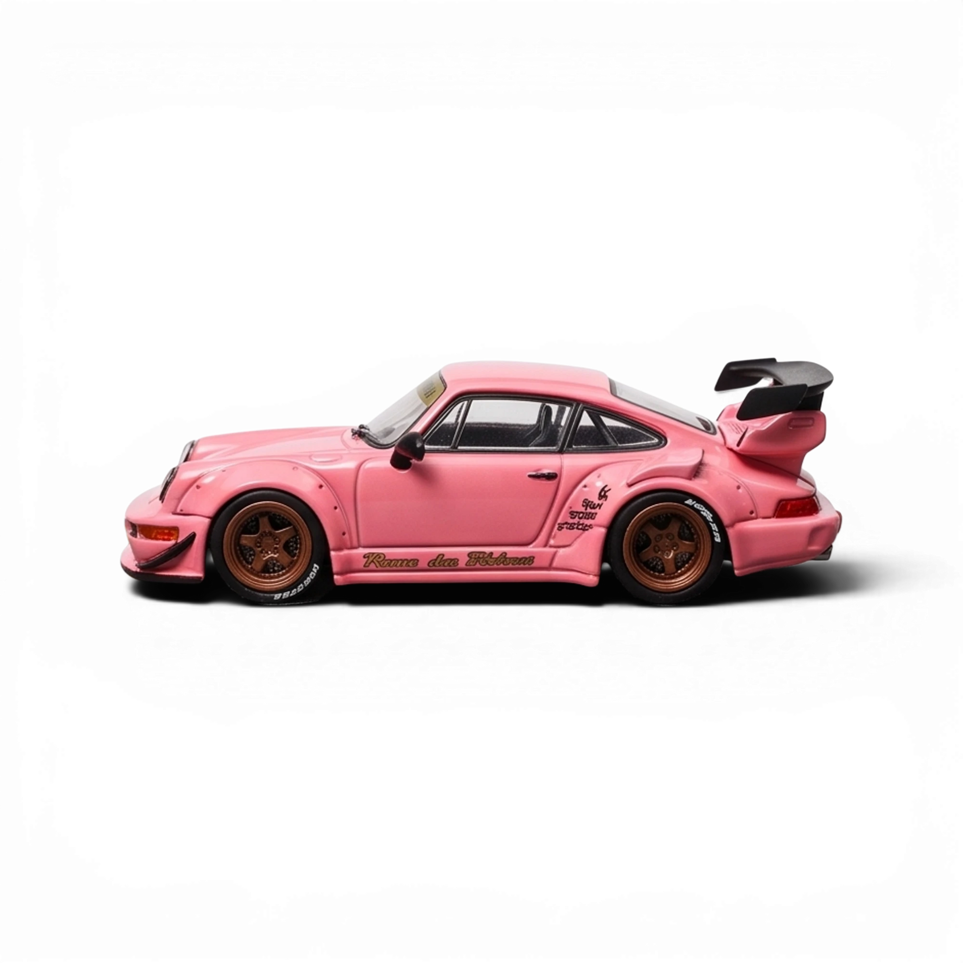 Lot57Supplies Diecast Shop Star Models RWB 964 GT Wing diecast car in SoCro Pink with bronze wheels, side view
