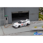 Lot57Supplies Diecast Shop 1:64 scale white Star Models S15 Silvia widebody diecast car with 23 livery in a garage