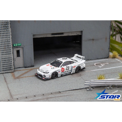 Lot57Supplies Diecast Shop 1:64 scale white Star Models S15 Silvia widebody diecast car with 23 livery in a garage