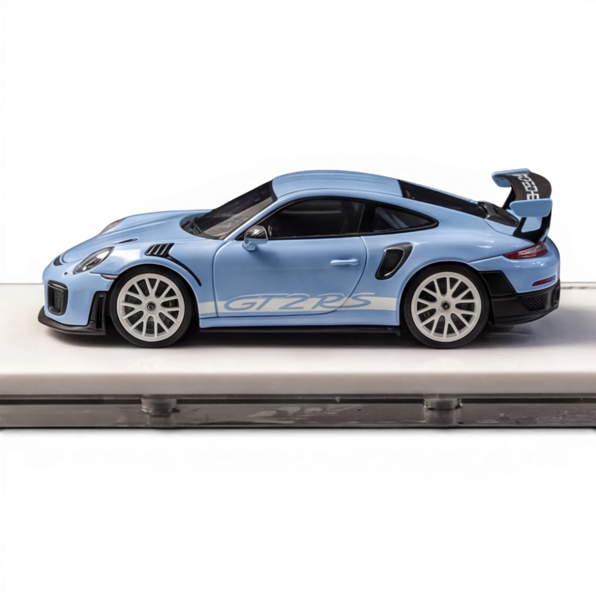 Lot57Supplies Diecast Shop SUHE Porsche GT2 RS 1:64 scale model in macaron blue resin with white racing stripes and white wheels.